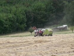 WS Tractor in grass field / Serrig, Rhineland-Palatinate, Germany Stock Footage