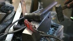 Blacksmith shaping a traditional Japanese cooking knife Stock Footage