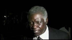 "Baby Doc" Duvalier in hotel, supporters around him News Clip