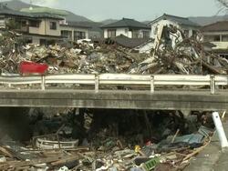 Destruction in Ofunato city, Iwate, Japan on 2nd April 2011; after tsunami following Tohuku earthquake of March 2011.  The tsunami wave reached approx 23 metres high and continued inland for 3 kilometers. Stock Footage