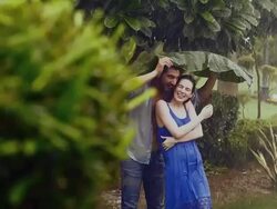 Young couple romancing in rain season, Delhi, India Stock Footage