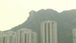 CLEAN : Hong Kong climbers hang protest banner off landmark cliff News Clip