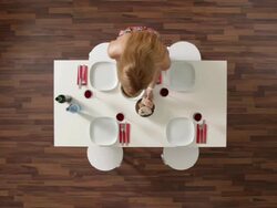 MS, Lockdown, woman setting the table, overhead view Stock Footage