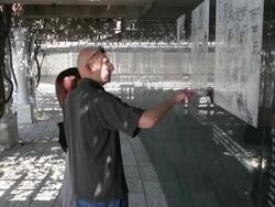 Mid shot of couple reading map with death camps. Stock Footage