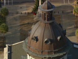 MS AERIAL Shot of flag waving in wind at top of courthouse / South Carolina, United States Stock Footage
