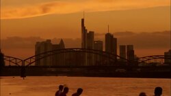 Boats travel on the Main River past the Deutschherrn Bridge. Stock Footage