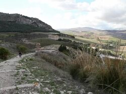Segesta, people walking to the vallley, the Doric temple on the background Stock Footage