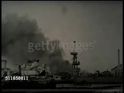 1937: SECOND SINO-JAPANESE WAR: PAN Shanghai harbor, docked Japanese cruiser (believed to be HIJMS Yubari) w/ smoking BG. OCCUPIED CHINA: VS Japanese soldiers walking in street following Japanese flag (Rising Sun, naval battle flag), rickshaws waiting. Instructional Video