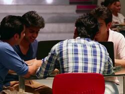 Four college students enjoying in the college Stock Footage