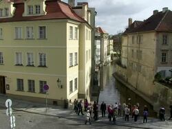 MS Tourist standing on bridge over cortovka river / Prague, Hlavni mesto Praha, Czech Republic Stock Footage