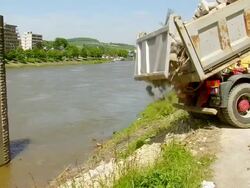 MS dumper loading off material at deconstruction of bridge over river Mosel / Wellen, Rhineland Palatinate, Germany Stock Footage