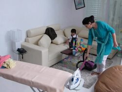 Woman cleaning house with a vacuum cleaner  Stock Footage