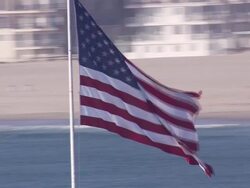 Aerial LA ECU large American Flag / Long Beach, California, United States. Stock Footage