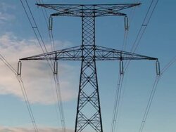 Time lapse vertical pan of electrical pylon at sunset Stock Footage