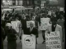 B/W 1960's civil rights march in city street / SOUND Stock Footage