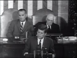 B/W 1961 President Kennedy speaks before Congress on space program / LBJ + Sam Rayburn in background Stock Footage
