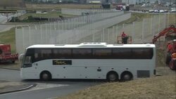 Construction workers erecting part of a security fence around the port of Calais News Clip