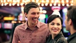 Friends talk and laugh outside casino in downtown Las Vegas Stock Footage