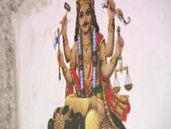 MS TU TD Hindu gods artwork on sides of stone wall / Delhi, Delhi, India Stock Footage