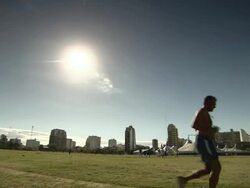 WS PAN Shot of people running in greenfield / Buenos Aires, Argentina Stock Footage