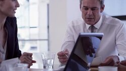 Administrators and doctors meeting in conference room Stock Footage