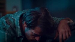 Man in motorcycle workshop building a bike Stock Footage