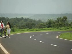Young couple talking, Malshej Ghat, Maharashtra, India Stock Footage