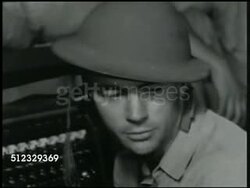 1941: U.S. MARINE BASE: COMMUNICATIONS: VS Colonel w/ radiomen in bunker sending message '.Send this, urgent, the enemy has landed, issue is still in doubt.' Radioman, Philippines, Pacific Front, WWII Instructional Video