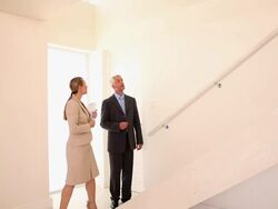 Estate agent showing buyer around Stock Footage