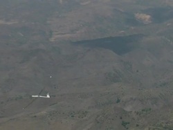 2010 AERIAL Gliders flying in haze over desert while condor is soaring above / Santiago de Chile, Gran Santiago, Chile Stock Footage