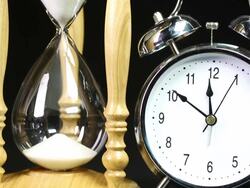 Alarm clock and Hourglass - Time Lapse Stock Footage