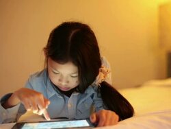 Tablet Girl happy in video game Stock Footage