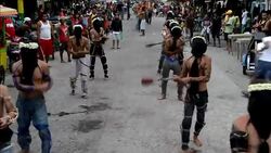 CLEAN : Catholic penitents flagellate themselves in the Philippines News Clip