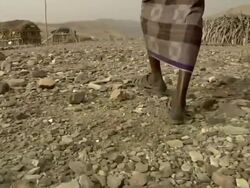 Man walking through village Stock Footage