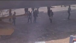 Overhead, ground shots of clashes between rival protesters Instructional Video