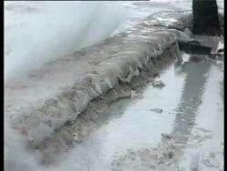 Waves crashing over sand bags, Kiribati, Central Pacific. Stock Footage