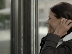 HD: Businesswoman Checking Her Hair In Shop Window Stock Footage