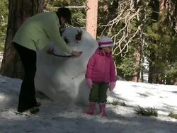 (HD1080i) Winter Fun: Family Building Snowman -Time Lapse- Stock Footage