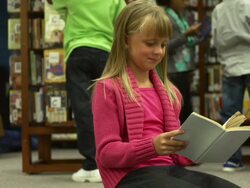 Children reading in Library Stock Footage