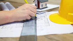 Architect working on blueprint Stock Footage