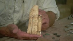 A pair of hands holds a damaged sculpture. Stock Footage
