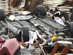 Car flipped by tornado Stock Footage