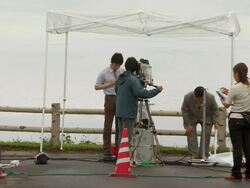 MS Shot of television news crews preparating for G8 meeting / Hokkaido Toyako, Japan Stock Footage