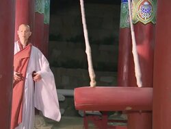 MS ZI Monks are hitting ornate temple bell by wooden ram / Hapchun, Gyeongsangnamdo, South Korea Stock Footage