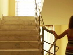 Girl walking down the stairs Stock Footage