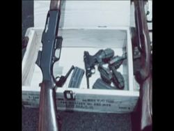 SYND 26-7-71 WEAPONS ARE FOUND IN POLICE RAIDS Instructional Video