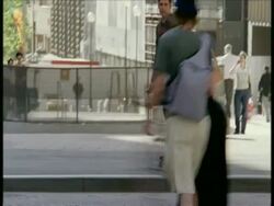 MS business man on rollerblades weaves in and out of traffic and pedestrians Stock Footage