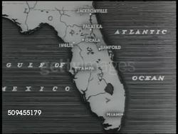 1936: MAP: Map of Florida. CU Animated map, showing location of canal moving down St. John River, moving west at Palatka, moving under Ocala & into Gulf of Mexico below Inglis. Instructional Video