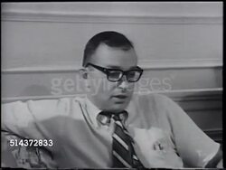1966: ALLARD LOWENSTEIN: MS Al walking down sidewalk w/ paperwork. VS Political activists, young adult male & female w/ Allard in meeting. [VO Al not sure Chinese communists want peace, must be way to live with without fighting, negotiating.] Instructional Video