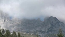 Paraglider flying over the Wilder Kaiser Valley Stock Footage